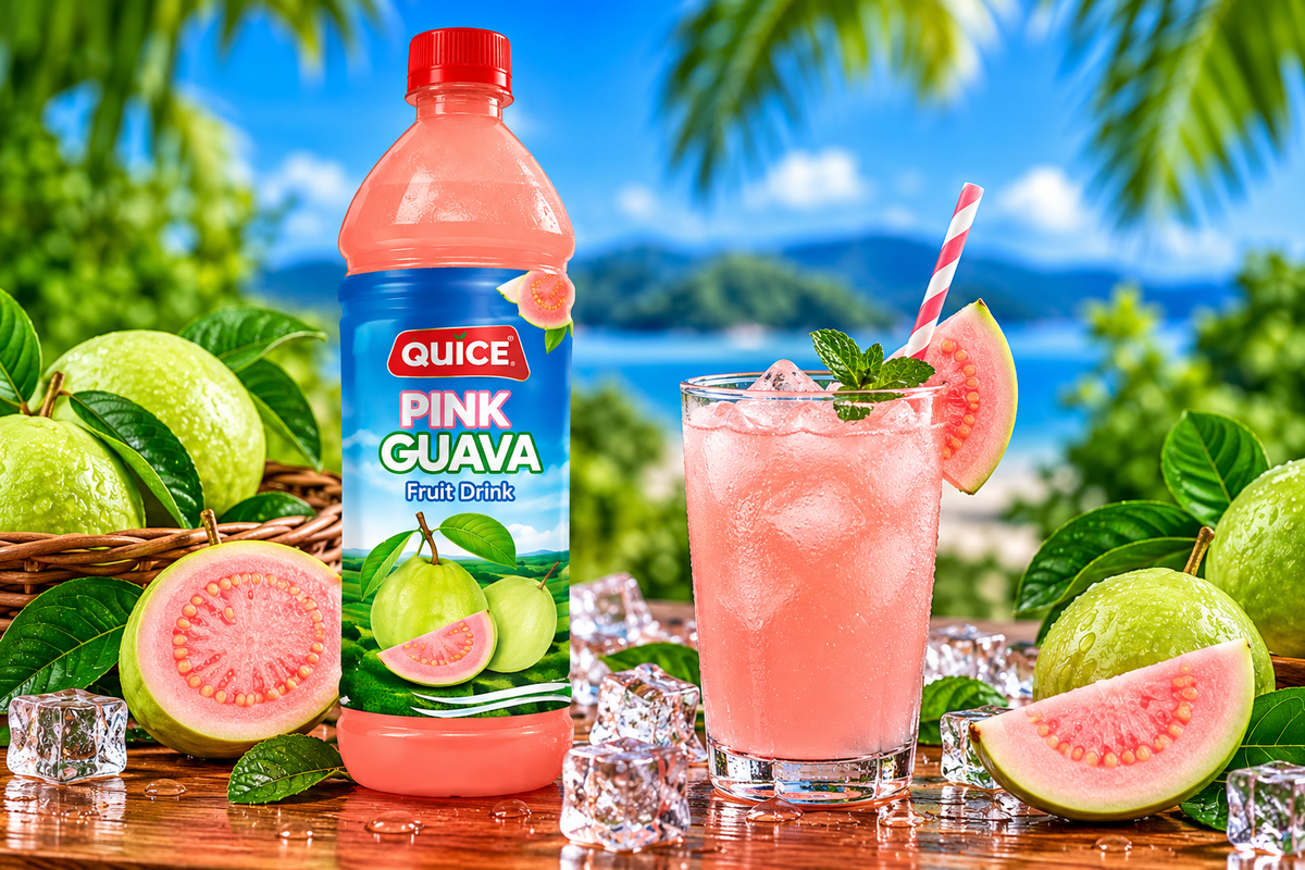 Quice Pink Guava Fruit Drink 1L bottle beside a glass of chilled pink guava drink with ice cubes, fresh guava slices and green leaves.