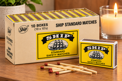 Ship Standard Safety Matches in yellow and black packaging with wooden matches on a warm kitchen tabletop