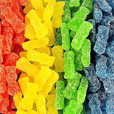 Bright yellow Sour Patch Kids Soft & Chewy Candy bags arranged in a 12-pack, showing sour-then-sweet gummy pieces