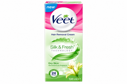 Veet Silk & Fresh Hair Removal Cream for Dry Skin 100ml in pink and pale green packaging, featuring the Veet logo, aloe vera and lily fragrance details, green leaf graphics, and a 24-hour moisturisation symbol against a clean white background.