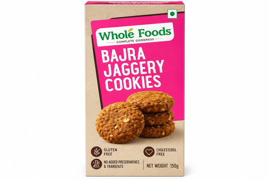 Whole Foods Bajra Jaggery Cookies 150g pack featuring a pink label and golden-brown cookies.
